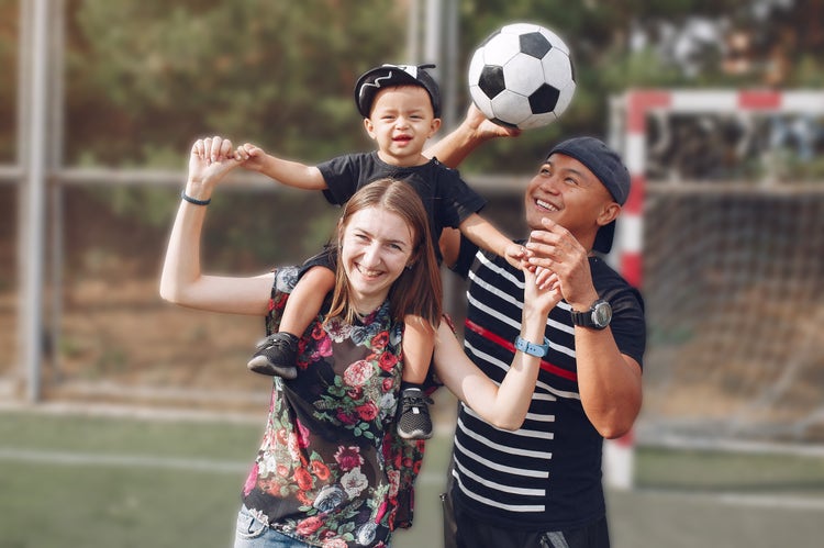 parent with young athlete, warm and approachable